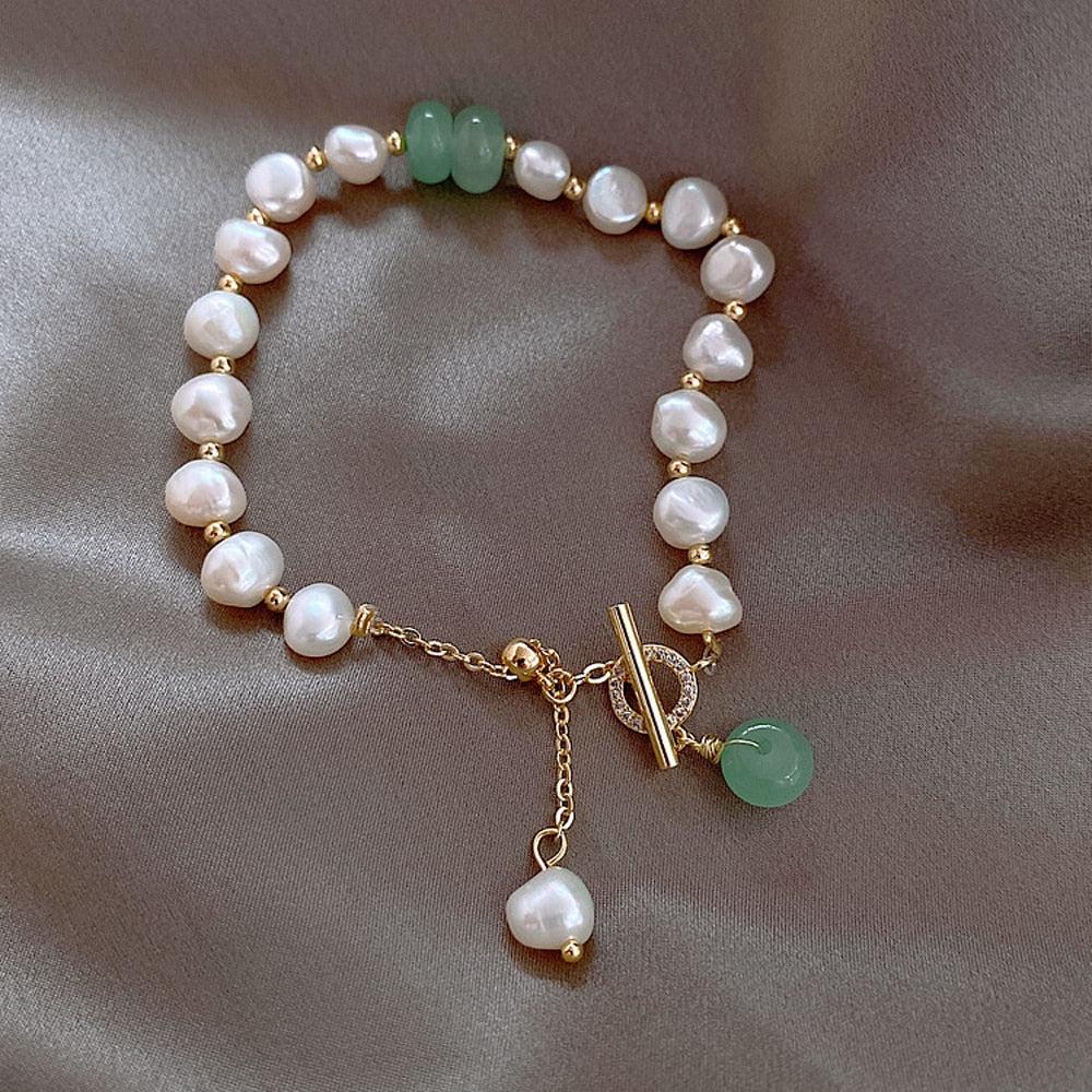 Estran | Bracelet avec détails blancs et pierres vertes – Vue 01