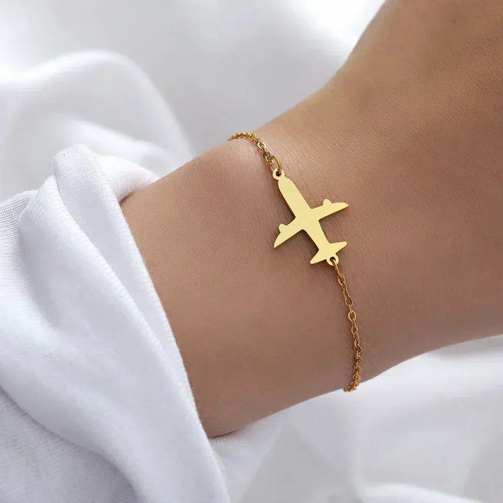 Envie de Voyage | Bracelet doré avec avion – Vue 01
